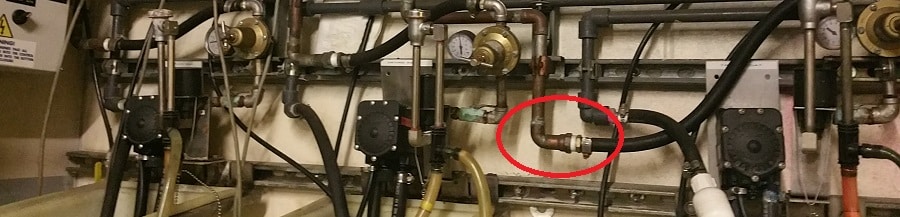 Piping-with-red-circle - Money Talks: The Impact of Pipe Labeling & System Schematics on Revenue | HydroCorp - HydroCorp