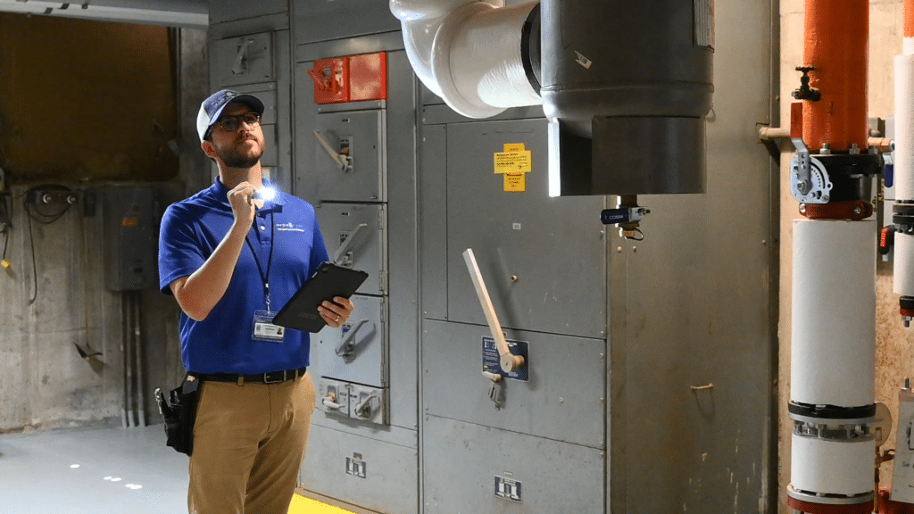 Inspector-Interior-Survey-with-Flashlight - Making Compliance Lemonade out of Cross-Connection Control Lemons | HydroCorp - HydroCorp