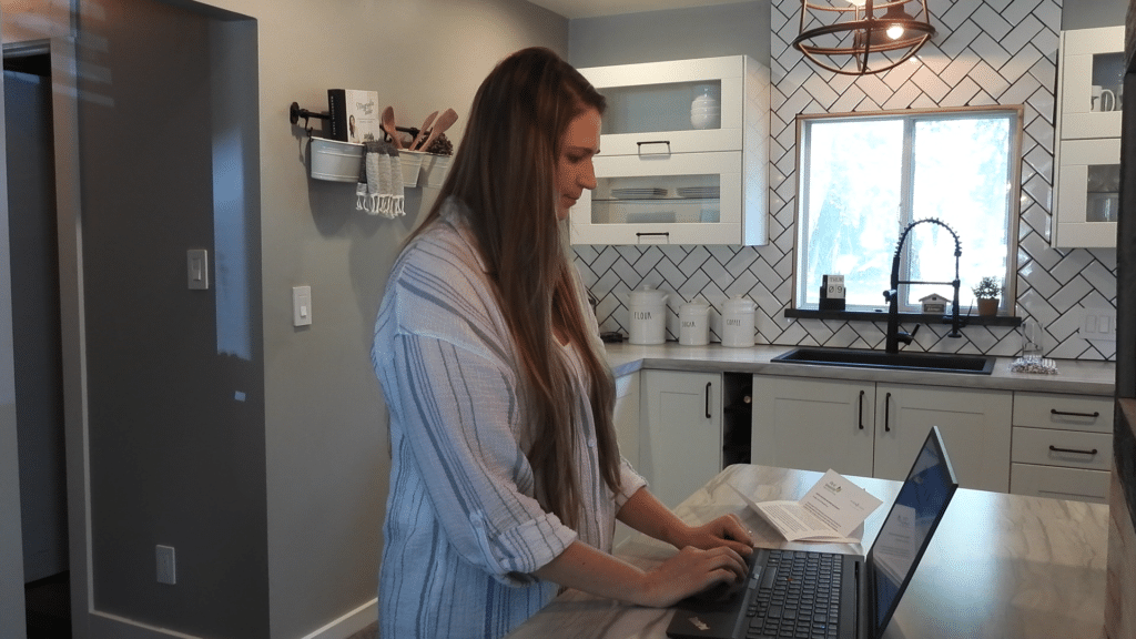 Residential-Water-Customer-at-Laptop - How Updating Your Piping Schematics Gives YOU a Strategic Advantage | HydroCorp - HydroCorp